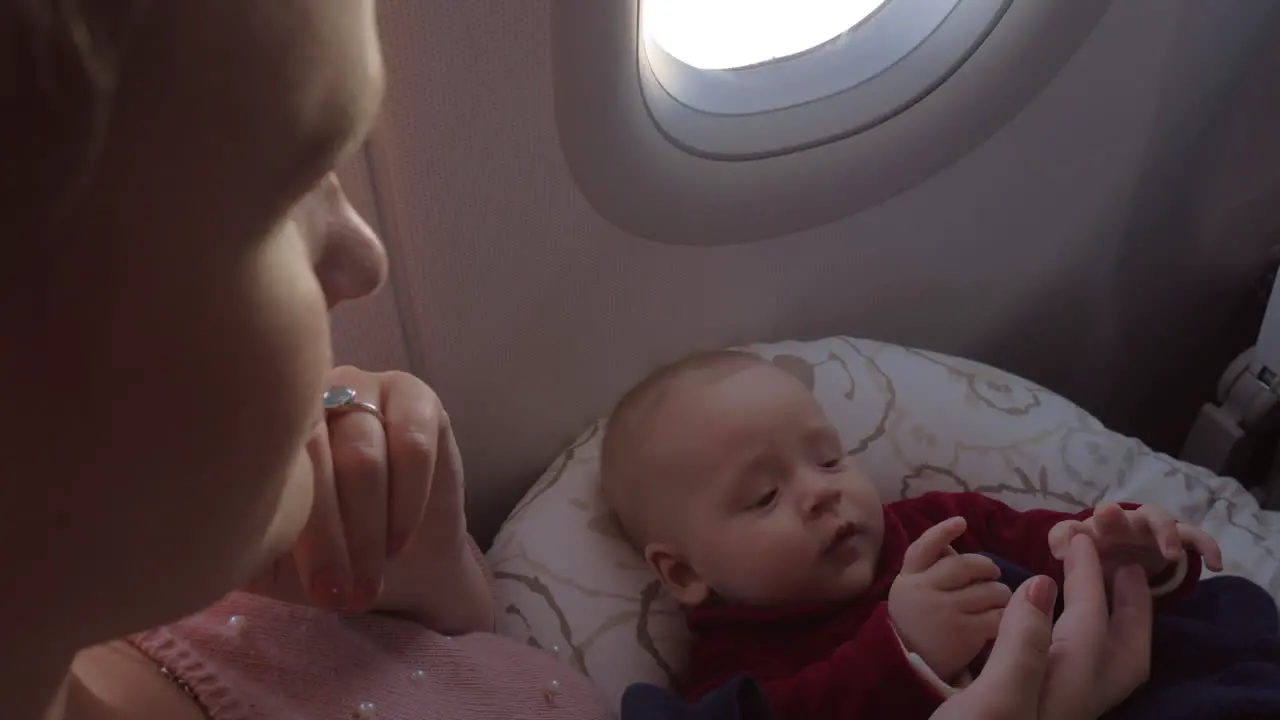 Mother and her baby chilling on airplane