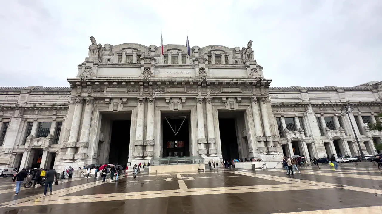 Panning across Milano Centrale train station building exterior in Italy