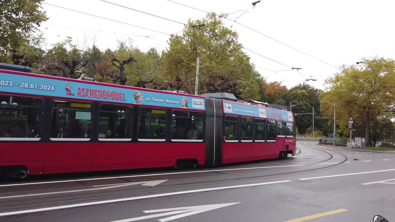 A Red Tram Drives the Streets of Bern Switzerland in Autumn Transport network