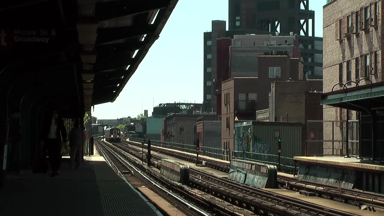 Subway Train Going Past Station Platform In Brooklyn