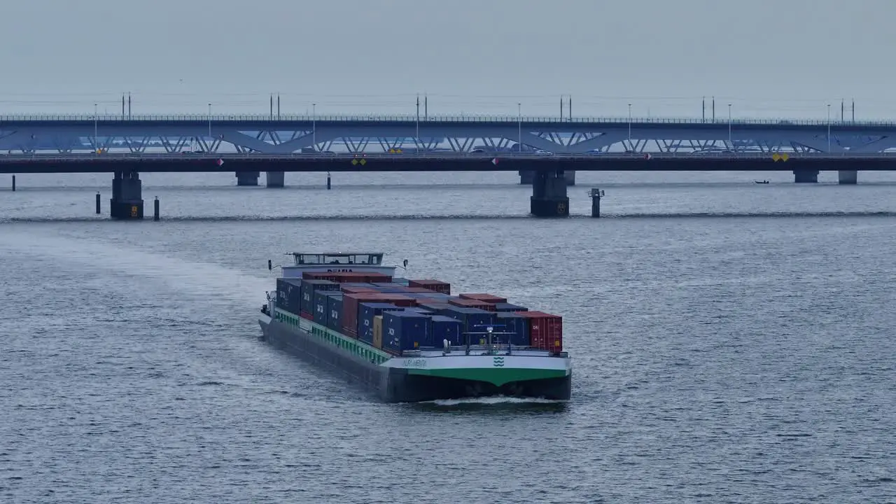 Cargo ship with containers carrying cargo on the river