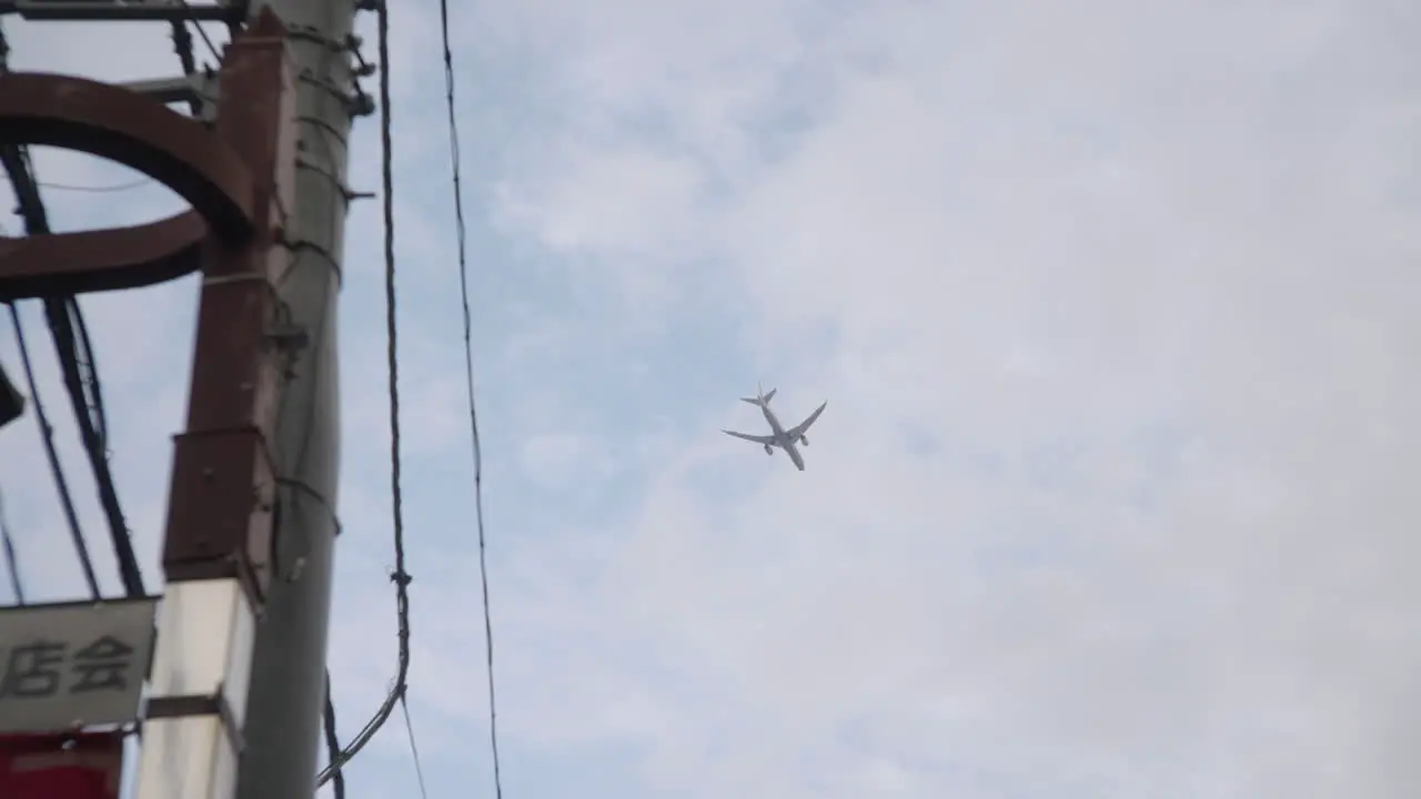 Looking Up On An Airplane Flying High In The Sky