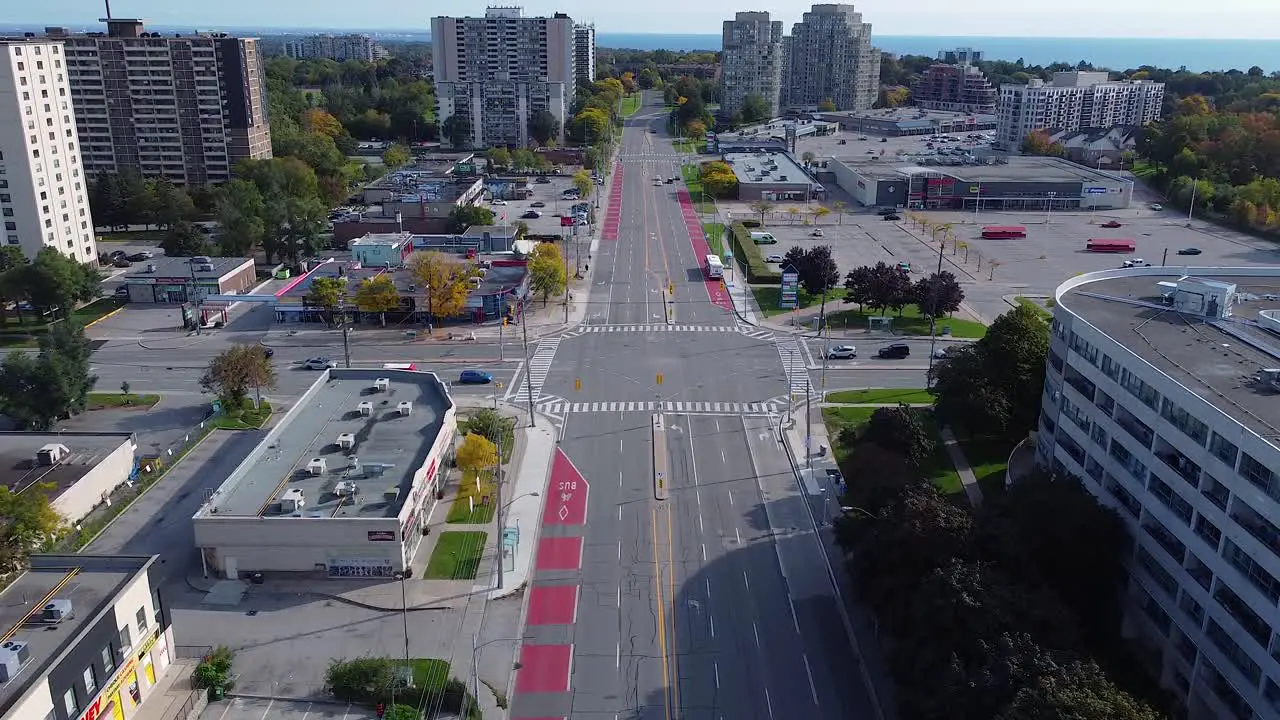 TTC buses and mobility van in bus lanes picking up passengers in urban city neighborhood