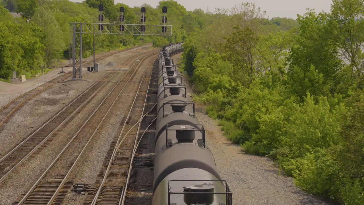 a long strin of tanker cars traveling the railroad tracks in Pennsylvania view from above