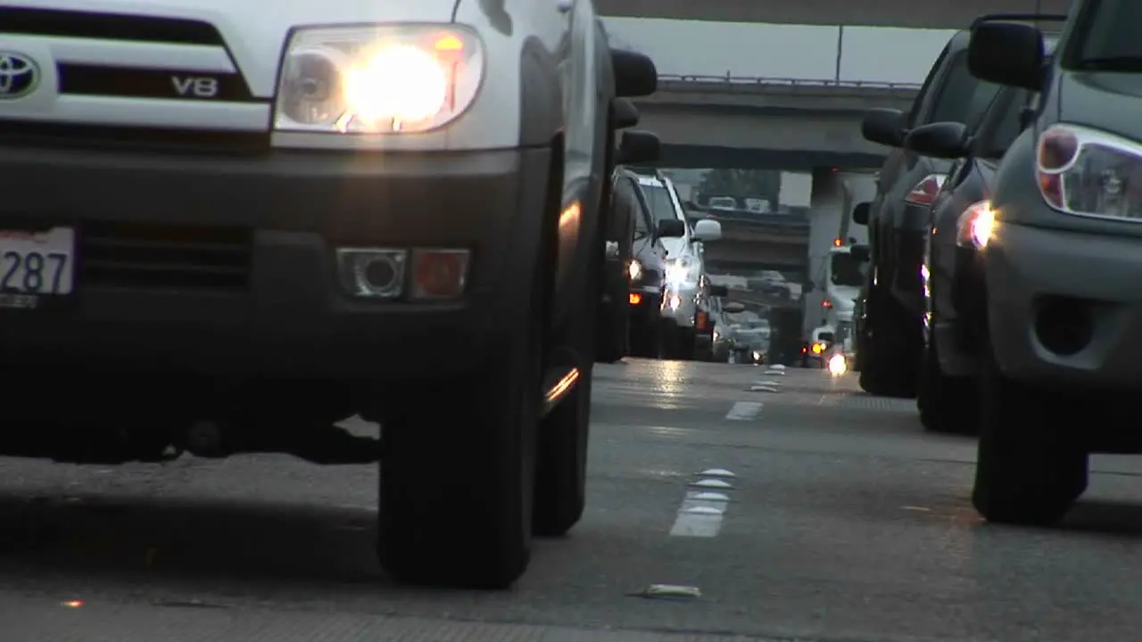 Traffic drives slowly on a crowded highway