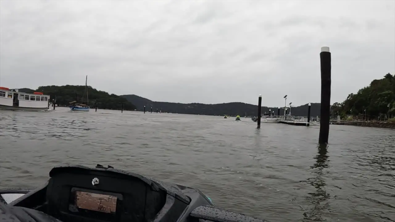 POV Jet-ski pulling out of a harbour on a grey overcast day