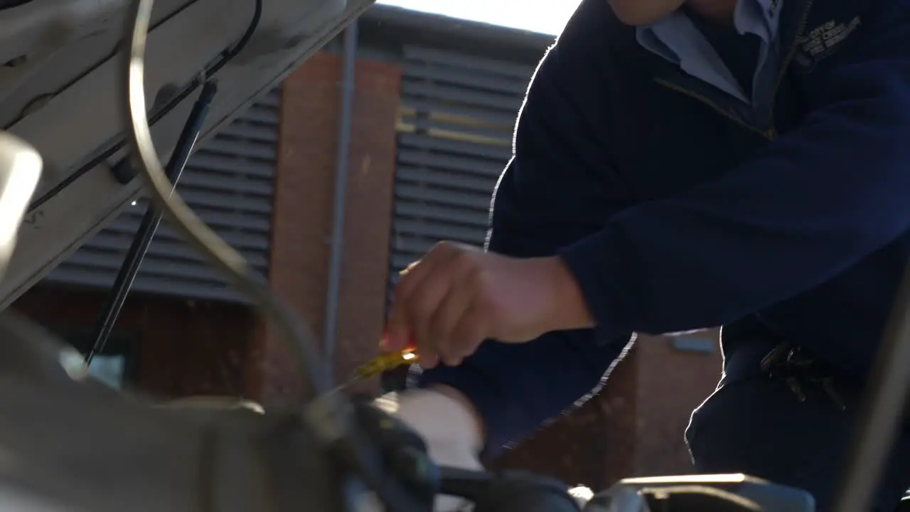 Emergency medical technician prepares the engine of an ambulance to be ready for emergency response