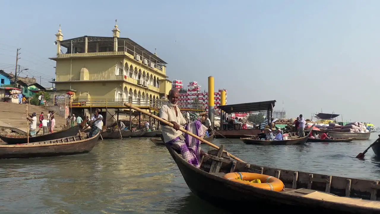 Passengers in local boat taxis arriving at the river bank of Buriganga river Dhaka