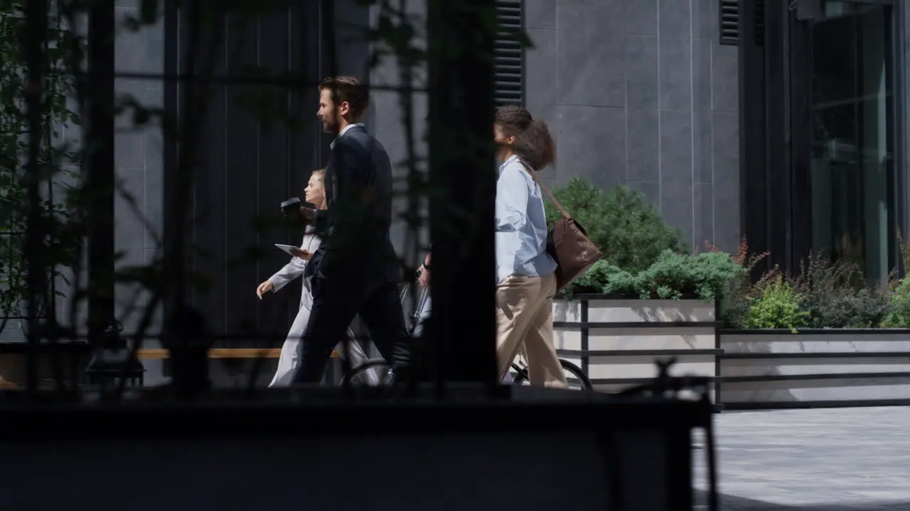 Corporate people walking holding bicycle kickscooter downtown Green transport