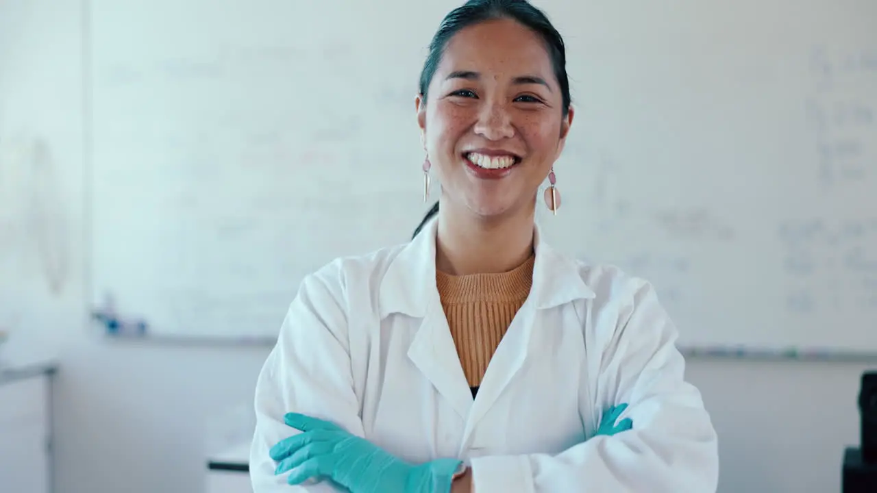 Happy arms crossed and a woman science teacher