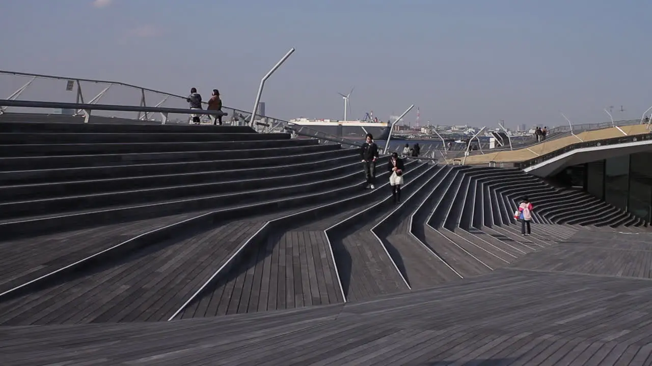 People walking on the rooftop plaza of Yokohama International Port Terminal