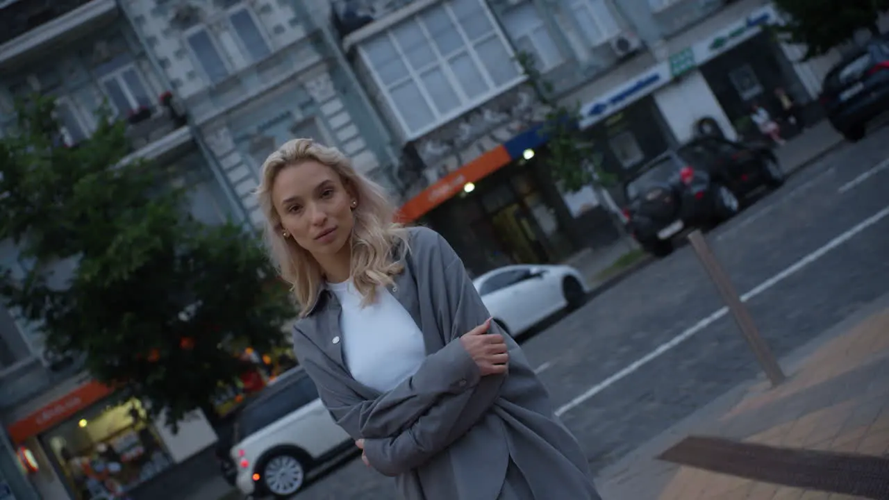 Woman model walking city at evening sunset in urban background