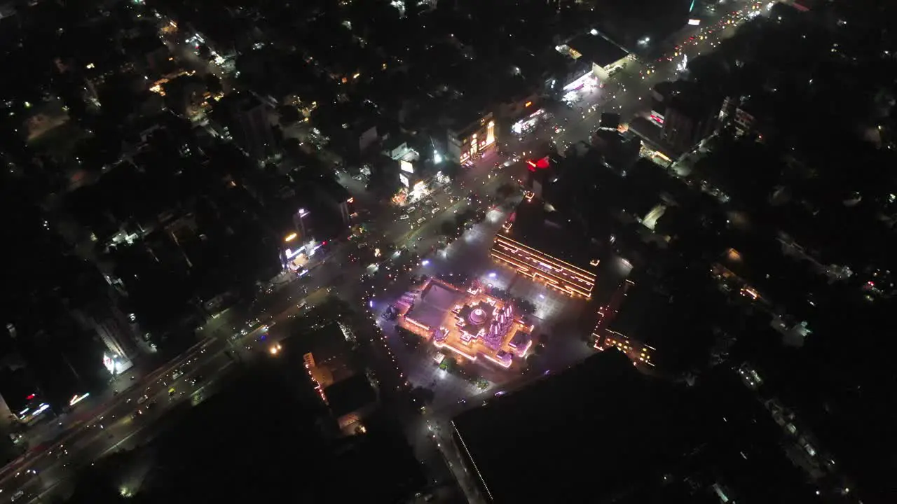 Rajkot aerial drone view Wide angle drone scene where the temple is glowing with lighting and many high rise buildings are visible around