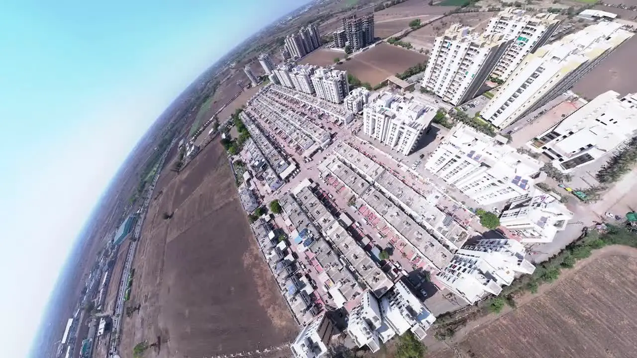 Aerial drone fly over cityscape architecture street in Gujarat rajkot india car buildings in sunny urban day outdoors transportation community