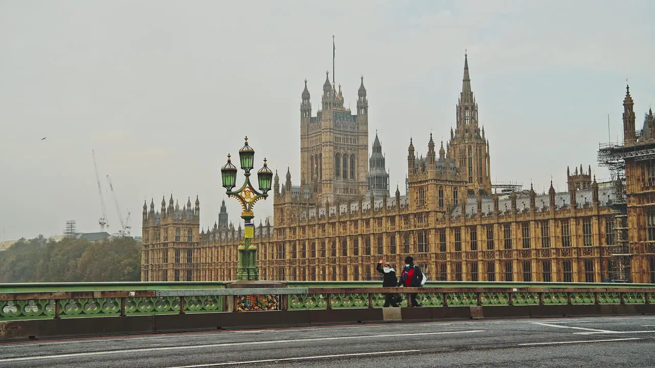 London in Coronavirus Covid-19 lockdown with empty quiet deserted roads and streets with no cars or traffic at Westminster Bridge with Houses of Parliament in England UK at rush hour