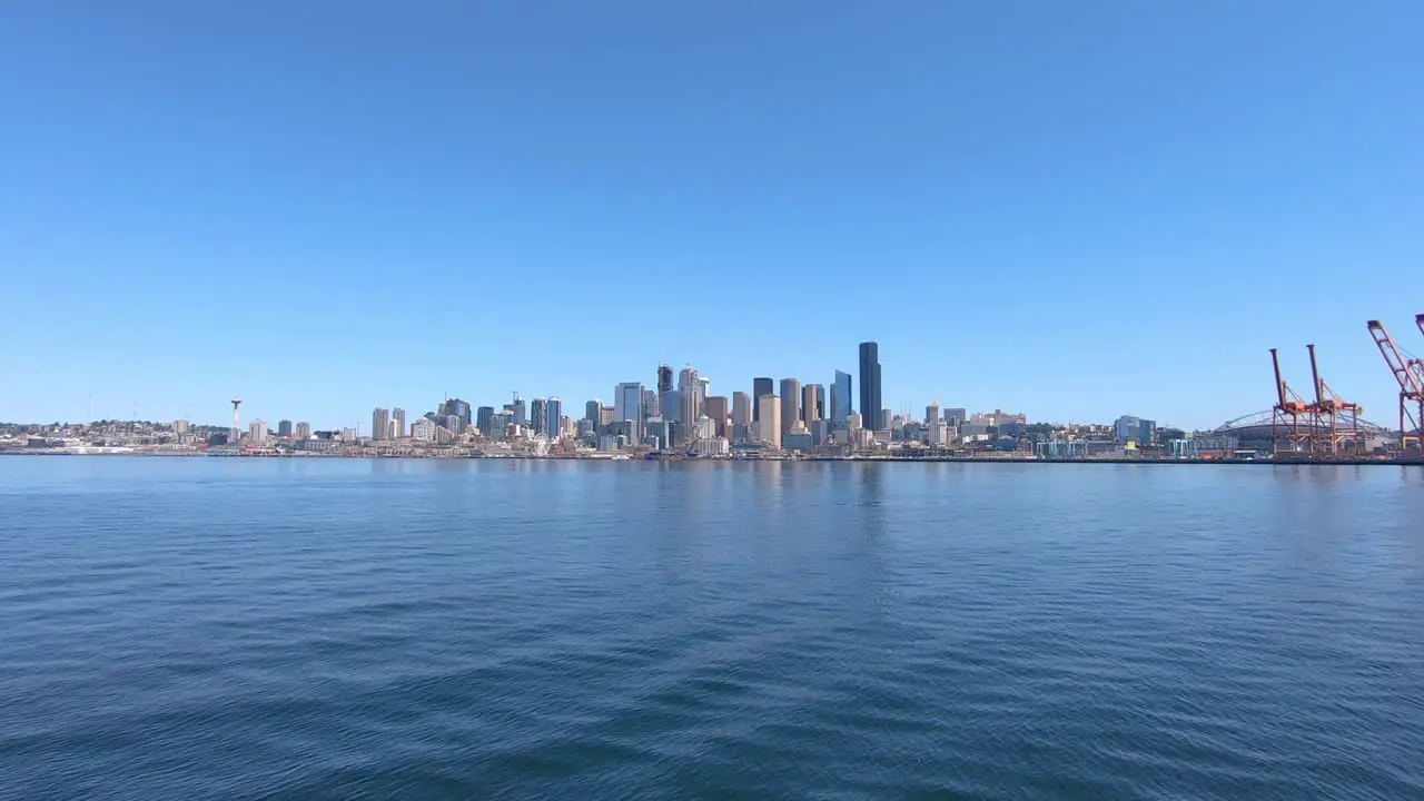 Seattle city coastline panorama with skyscrapers and port cranes