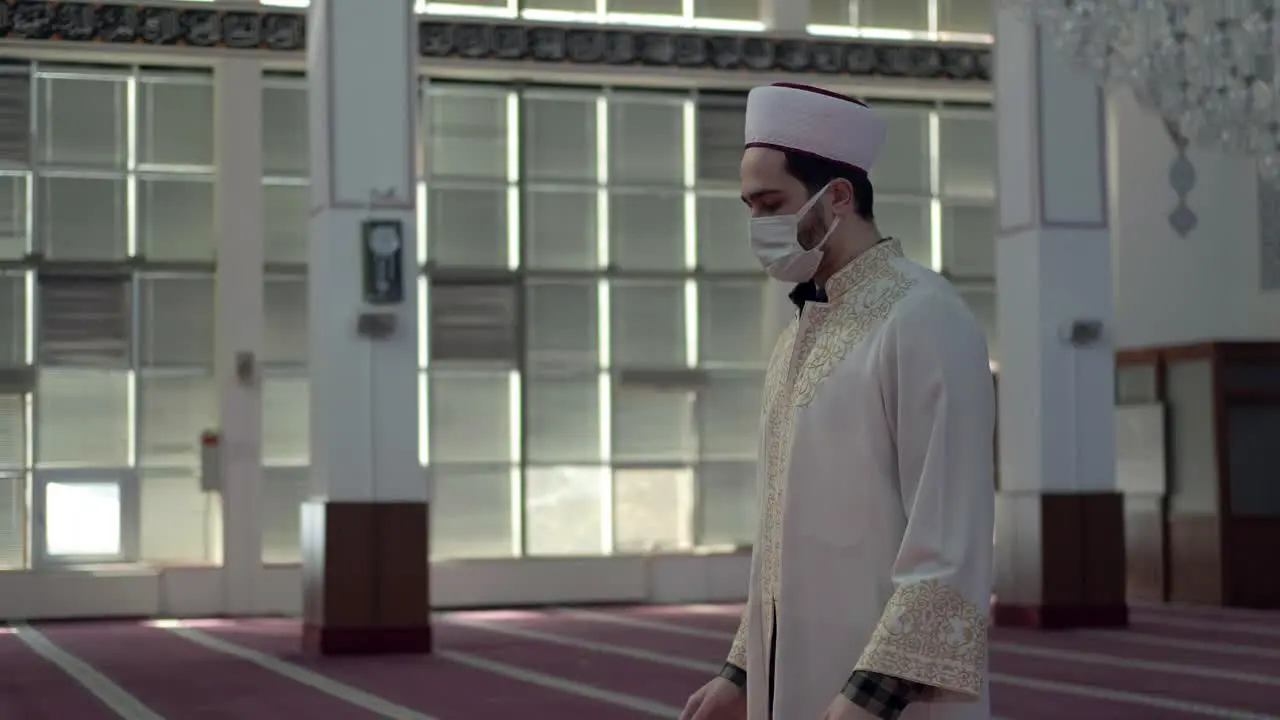 Man Wears A Mask And Worships in the Mosque