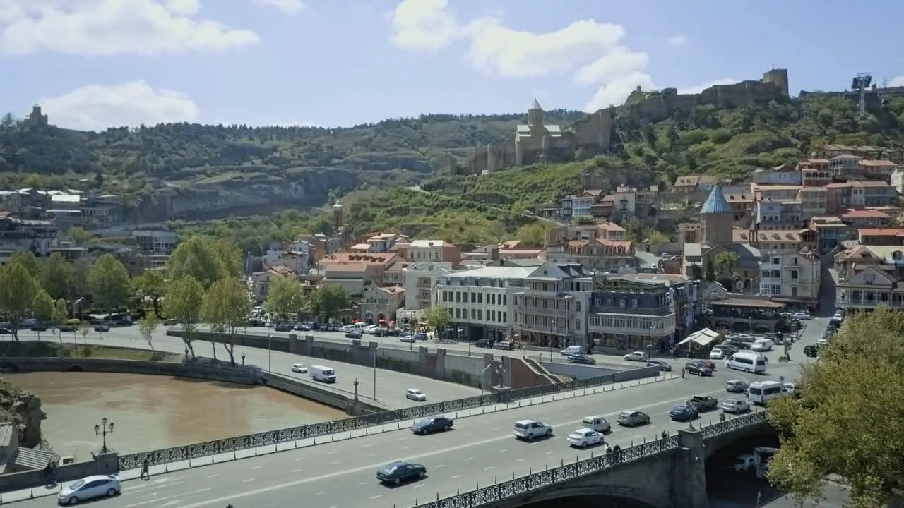 Tbilisi aerial view on old town autumn view no sun cars passing by old town glass bridge