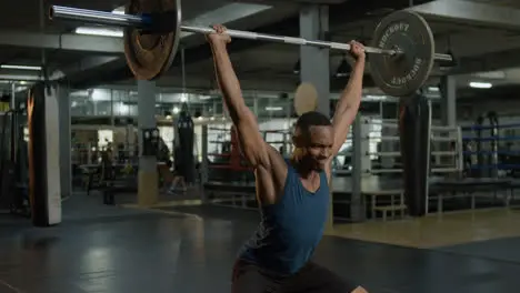 An athletic african american man in the gym