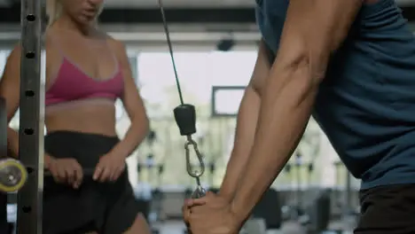 Close-up view of african american man and caucasian female monitor in the gym