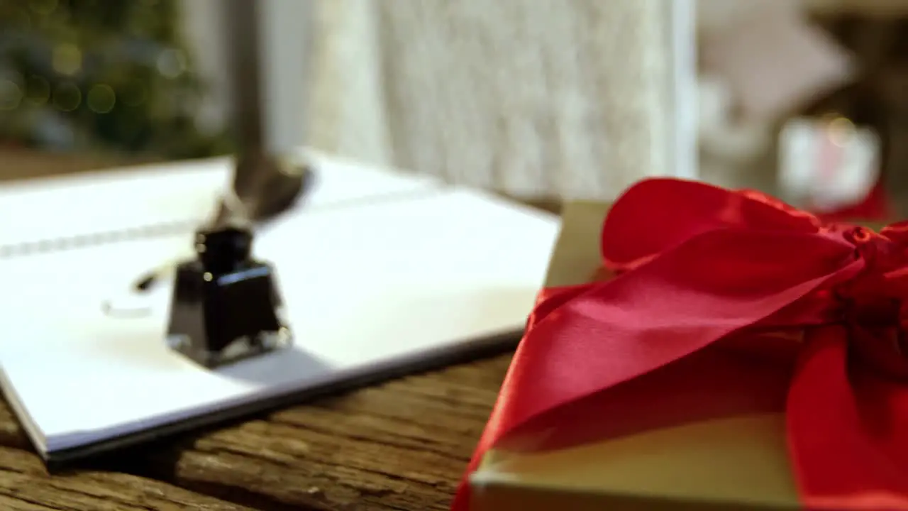 Close-up of gift box diary ink bottle and quill