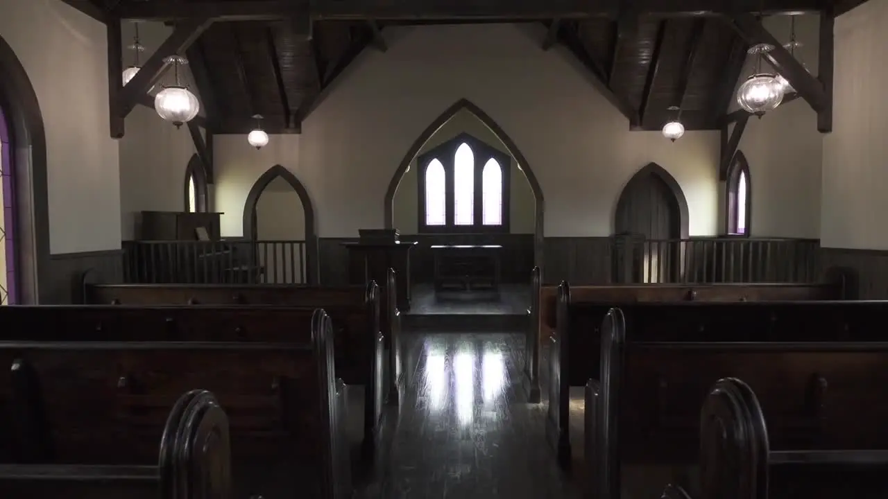 Interior of a rustic church and pews