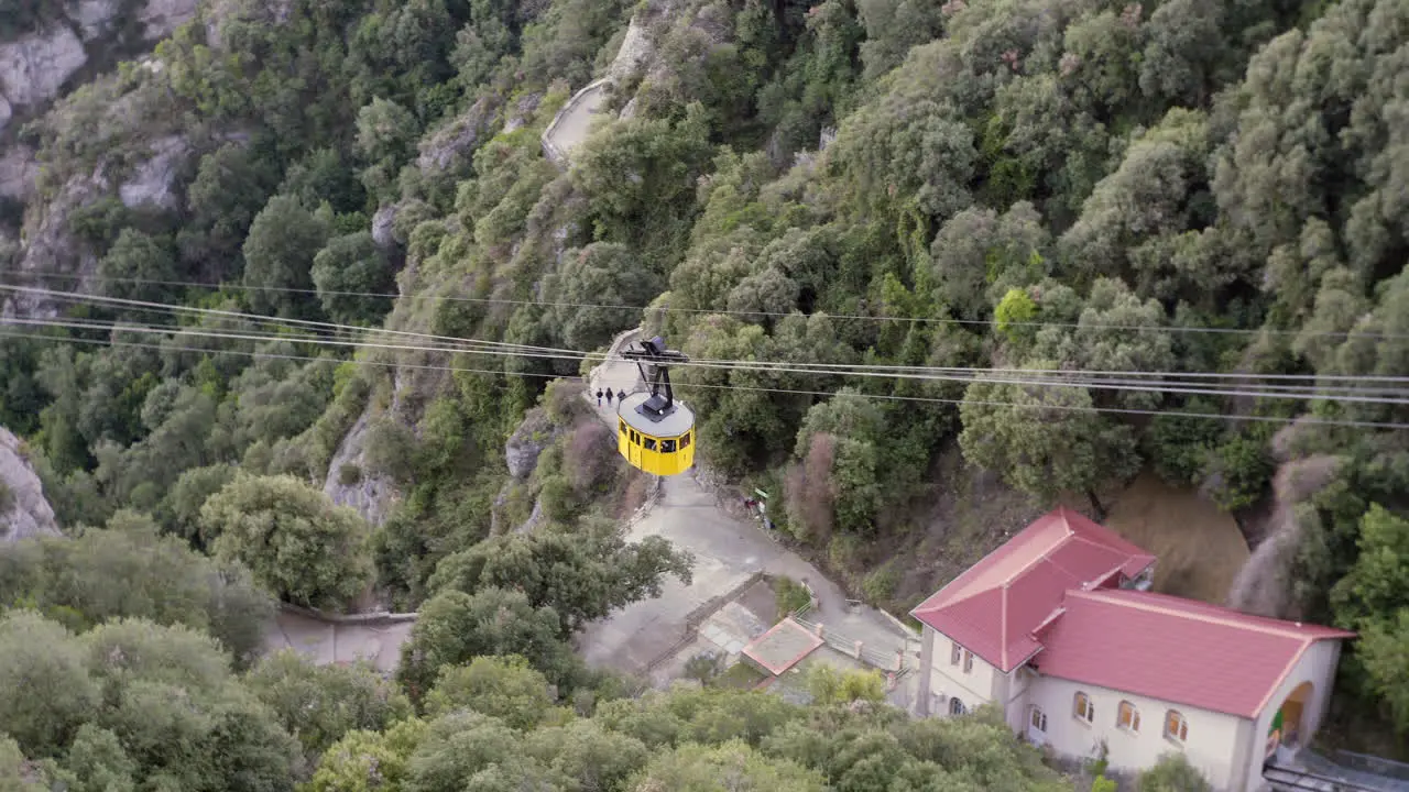 Yellow cable car going up to the monastery on the Montserrat mountain in Catalonia Spain