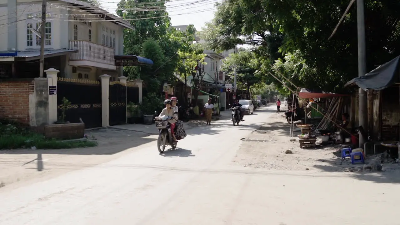 small street in a town near mandalay in myanmar