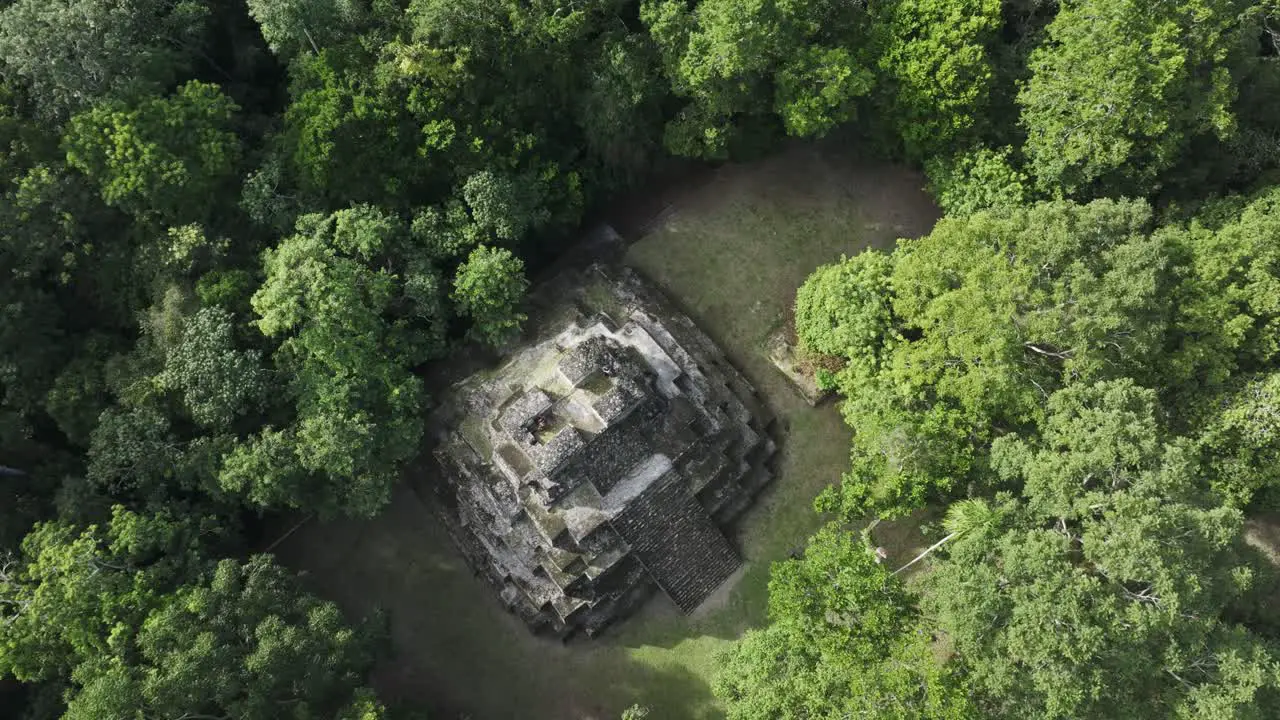 Flying above famous yaxha maya ruins in jungle of Guatemala aerial