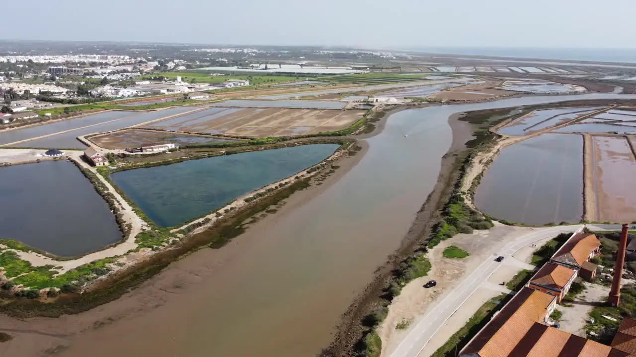 Algarve Portugal The Galao River flows to the Atlantic Sea through salt Lagoons and nature Reserve on a warm spring day