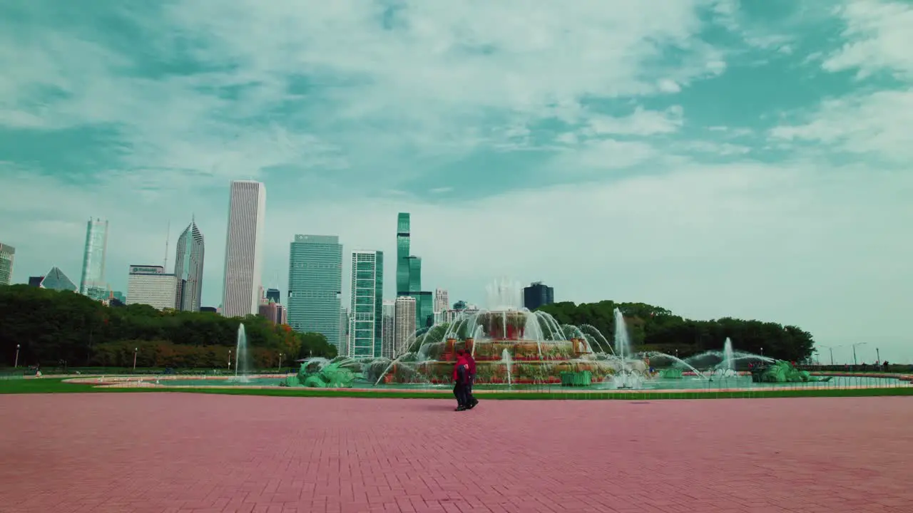 Aerial Chicago Tracking Around Buckingham Fountain tourists walking Skyscrapers In The Background