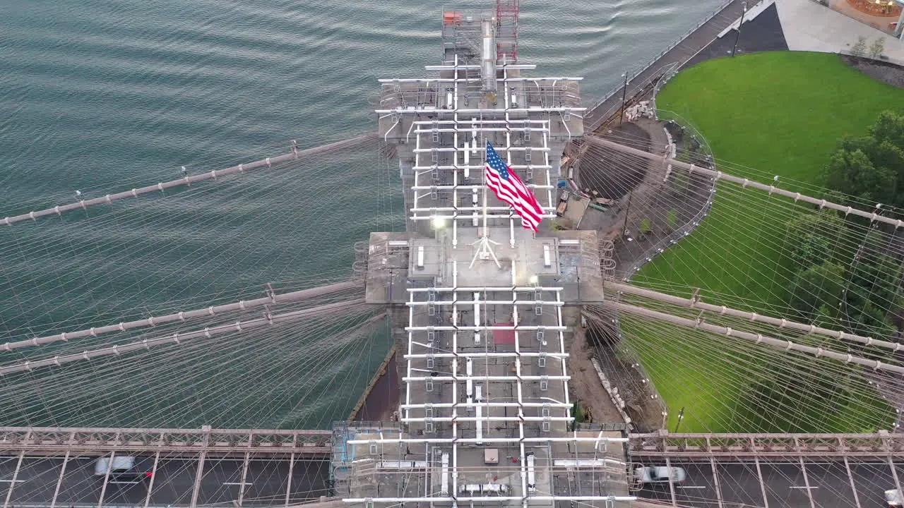 An aerial view close to the Brooklyn Bridge east tower at sunrise