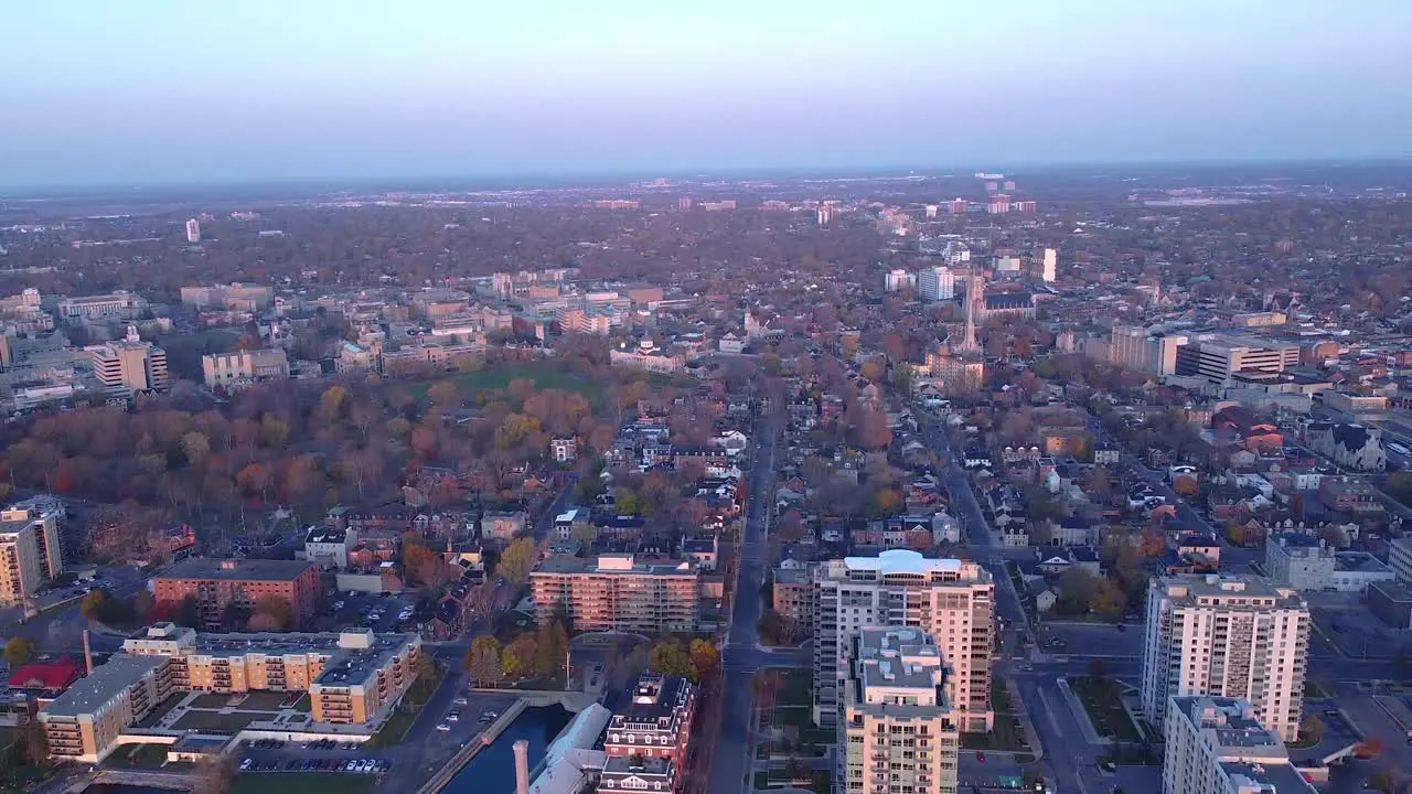 aerial going up looking over a city during fall