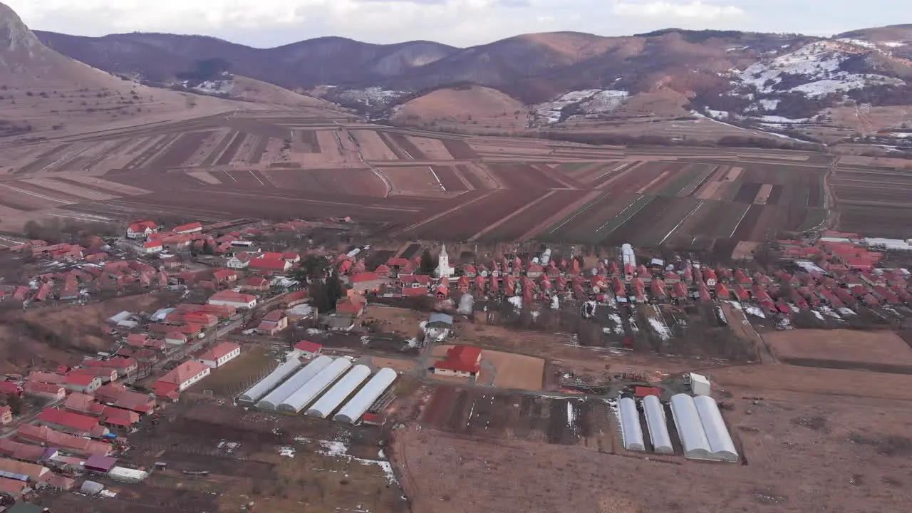 Coltesti village and church seen from a drone at winter aerial view