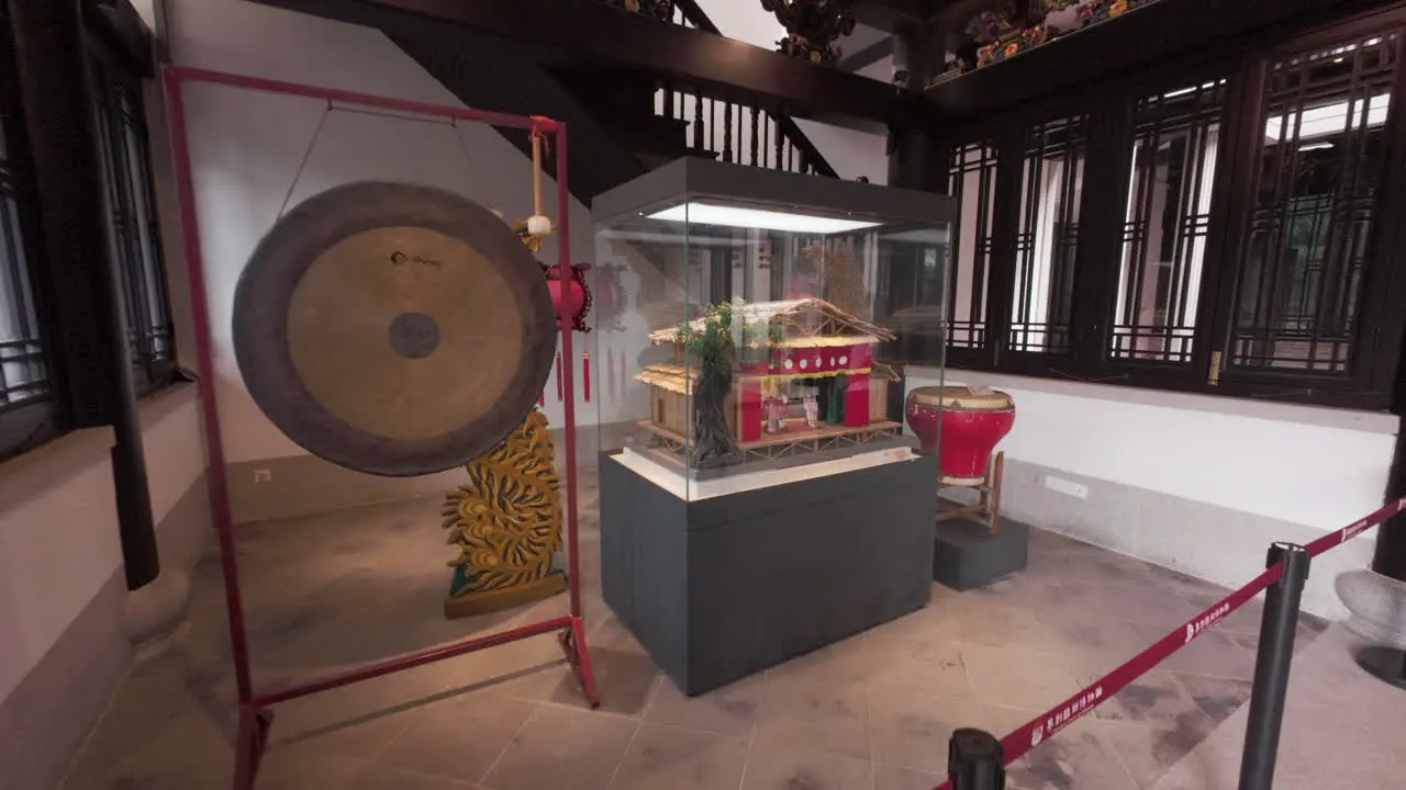 Exposition model of an old Chinese Opera theatre with huge Gong drum in the exhibition hall at Chinese Opera centre in Guangzhou China