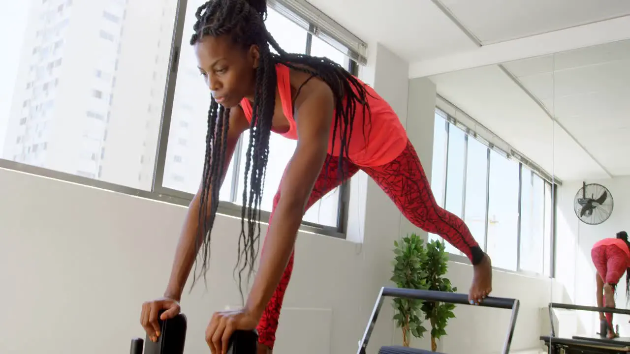 Women doing exercise with rowing machine 4k