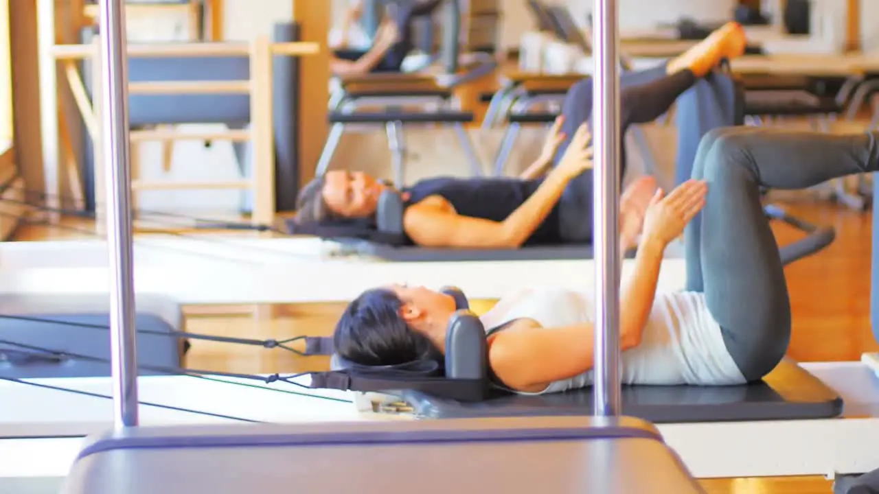 Women exercising on gym equipment