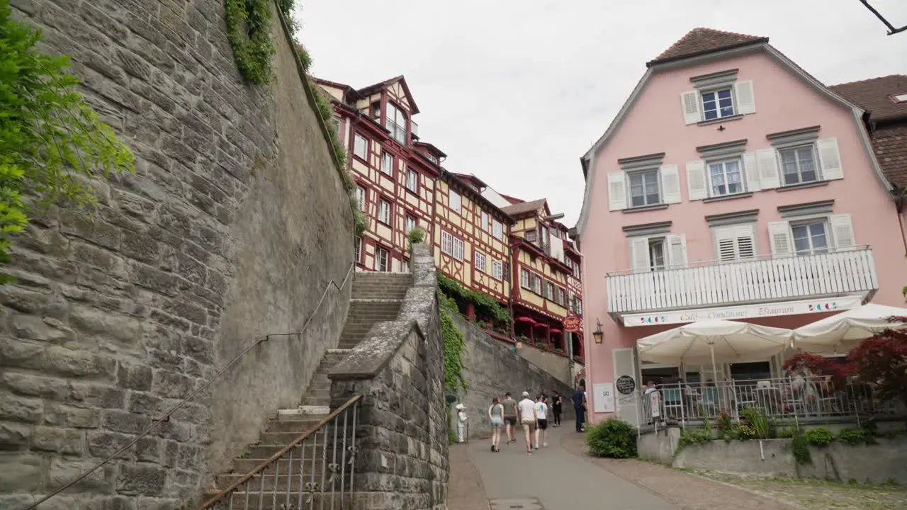 Walking through Meersburg old town past colorful half-timbered houses and quaint streets daylight