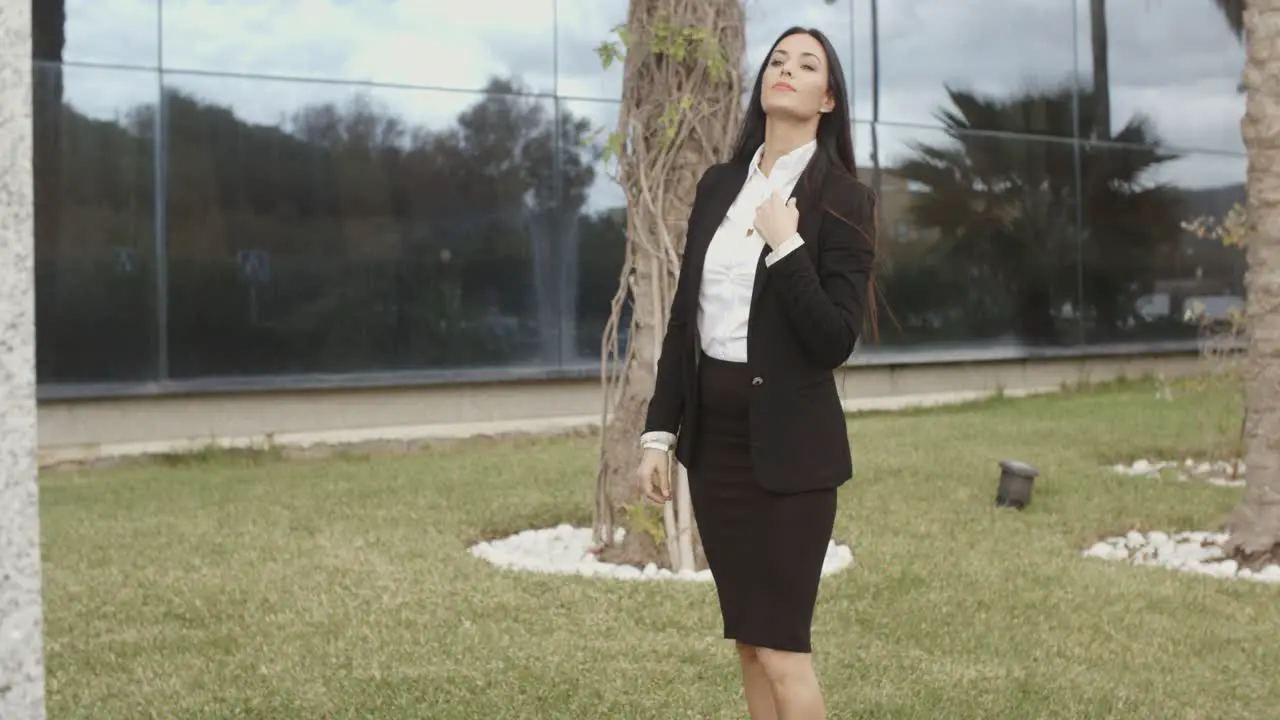 Young professional woman standing waiting