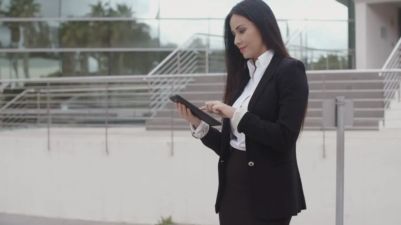 Stylish businesswoman using her tablet