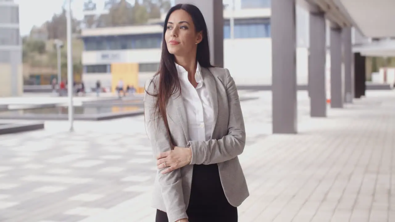 Grinning optimistic business woman