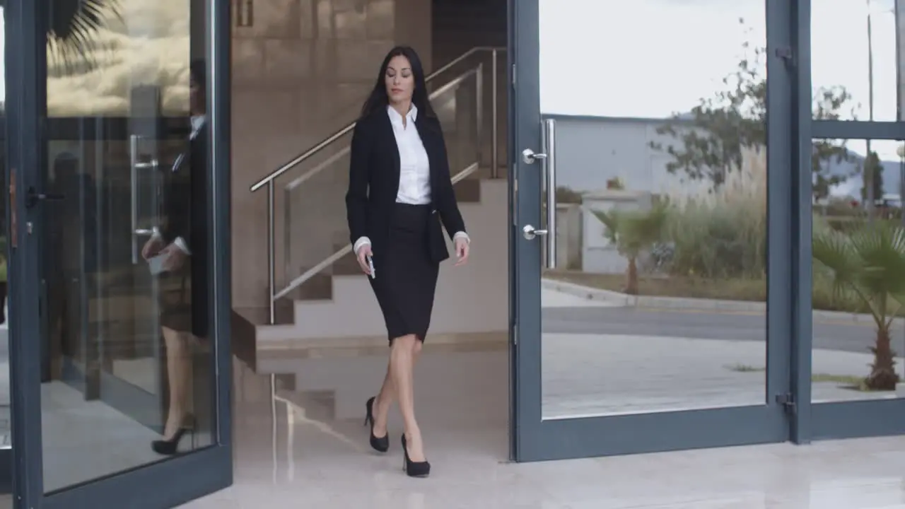 Businesswoman walking through an office complex