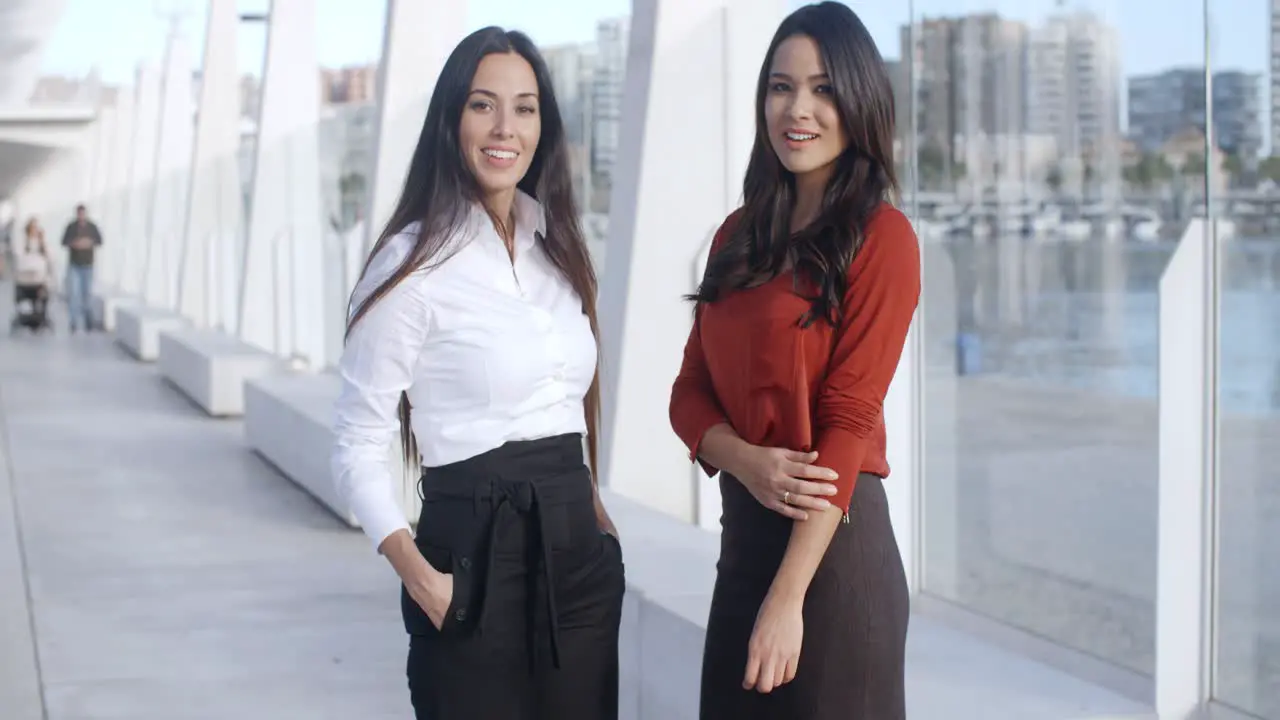 Two Adorable Women Standing at Promenade