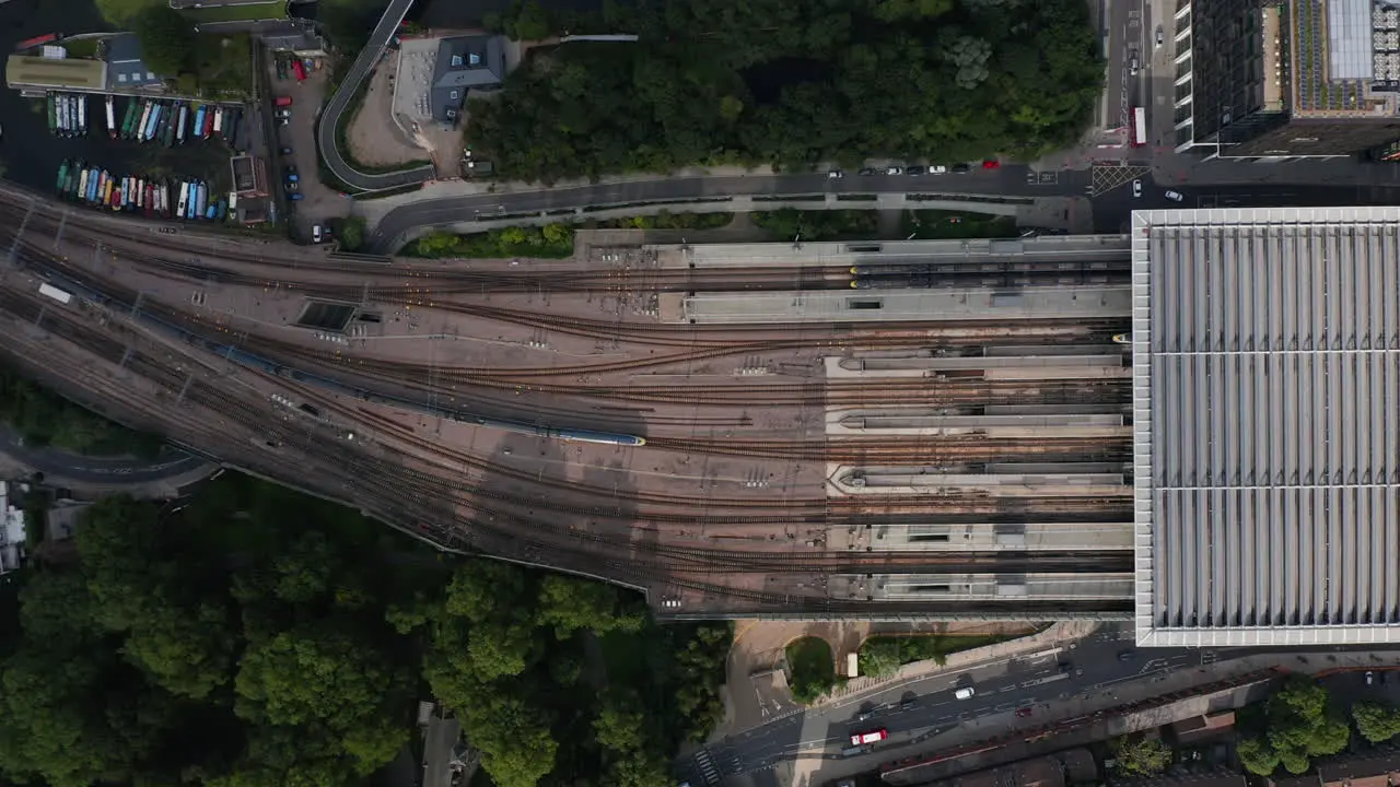 Aerial birds eye overhead top down view of train leaving St Pancras train station Railway transport in city London UK