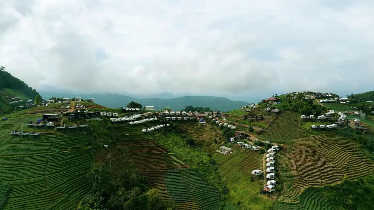 4K Cinematic nature aerial footage of a drone flying over the beautiful mountains of Mon Jam next to Chiang Mai Thailand on a sunny day