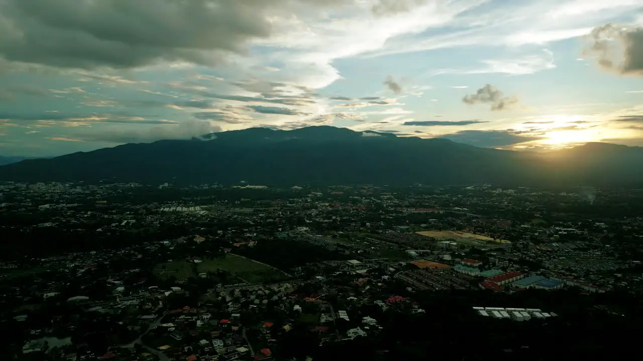 4K Cinematic nature aerial footage of a drone flying over the beautiful city of Chiang Mai Thailand during sunset