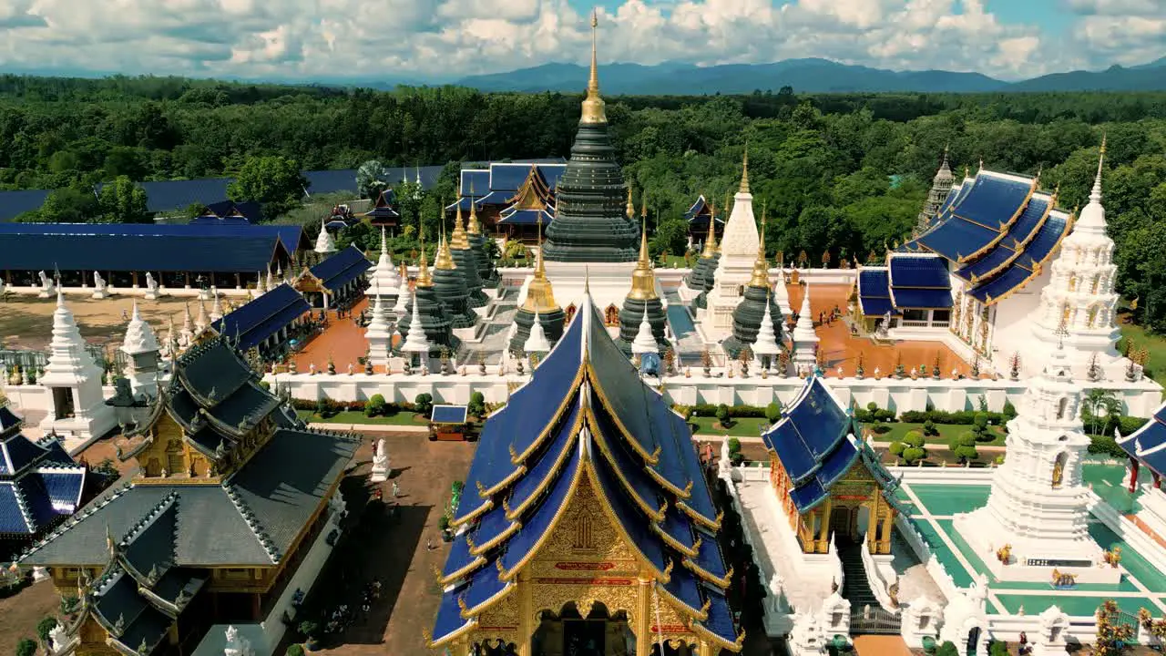 4K Cinematic nature aerial drone footage of the beautiful temple of Wat Ban Den next to Chiang Mai Thailand on a sunny day