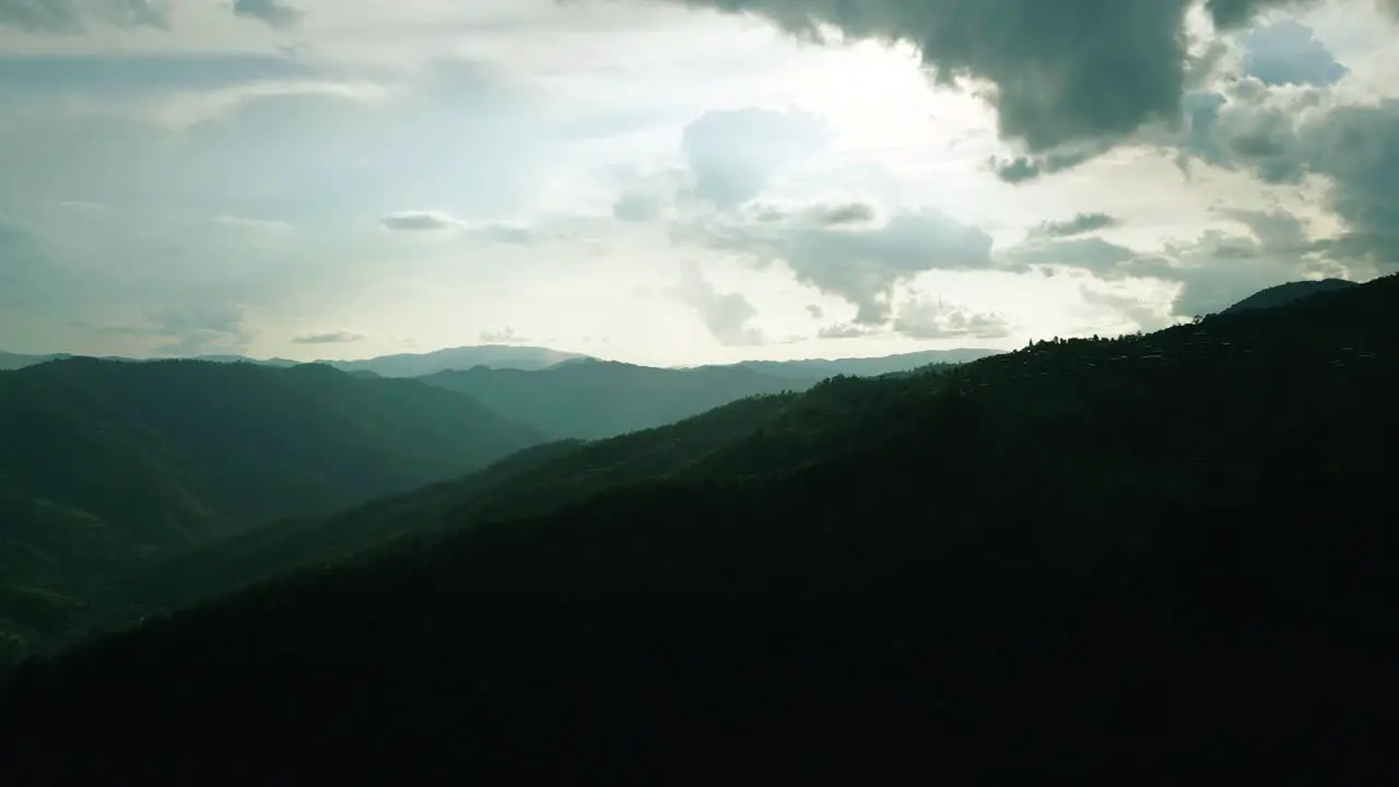 4K Cinematic nature aerial footage of a drone flying over the beautiful mountains of Chiang Mai Thailand on a sunny day