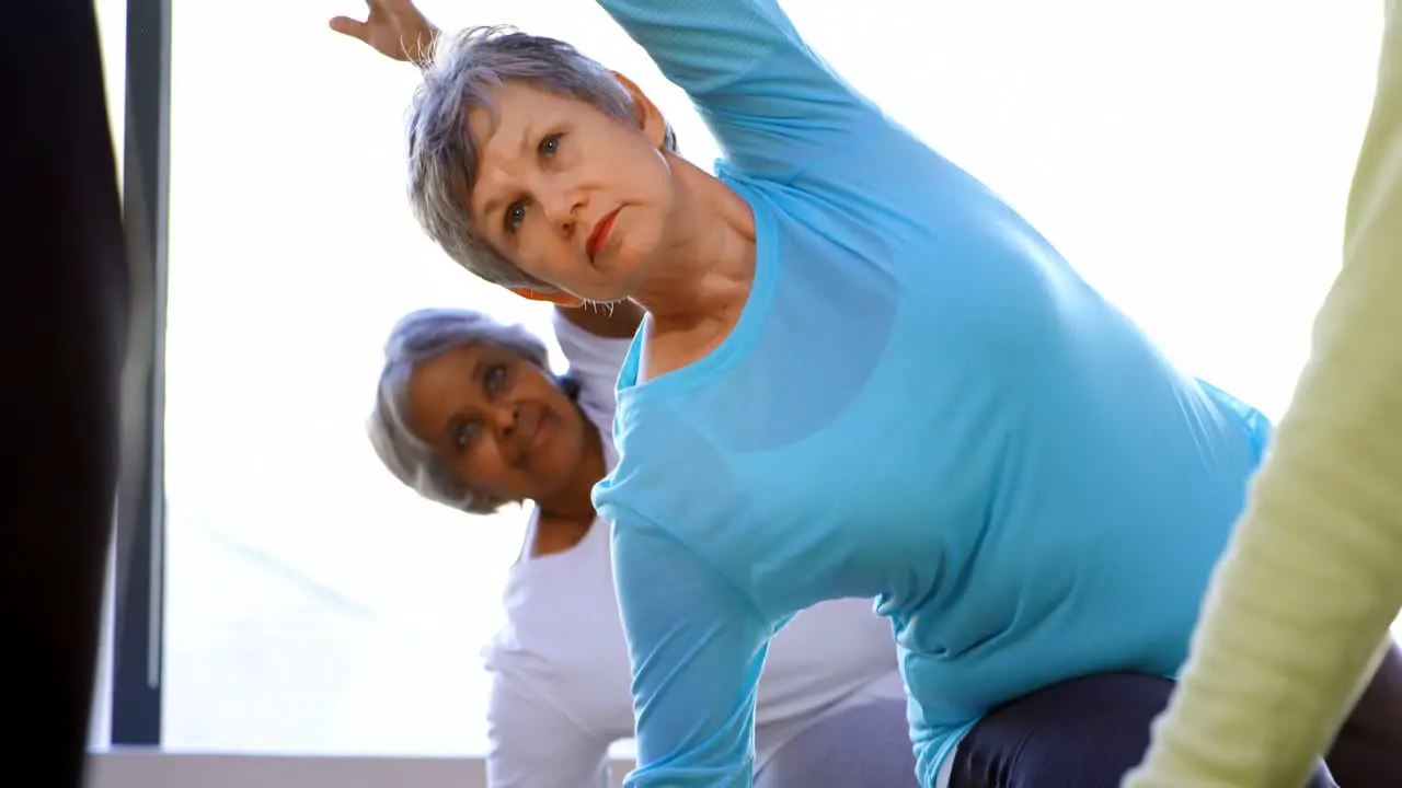 Senior women performing yoga 4k