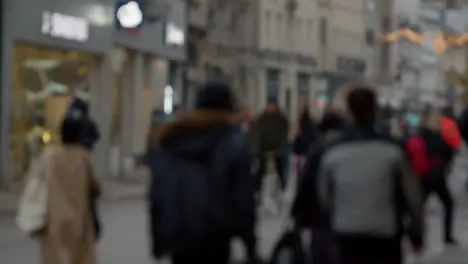 Defocused Long Shot of Crowd of People Walking Down a Busy Street In Oxford England